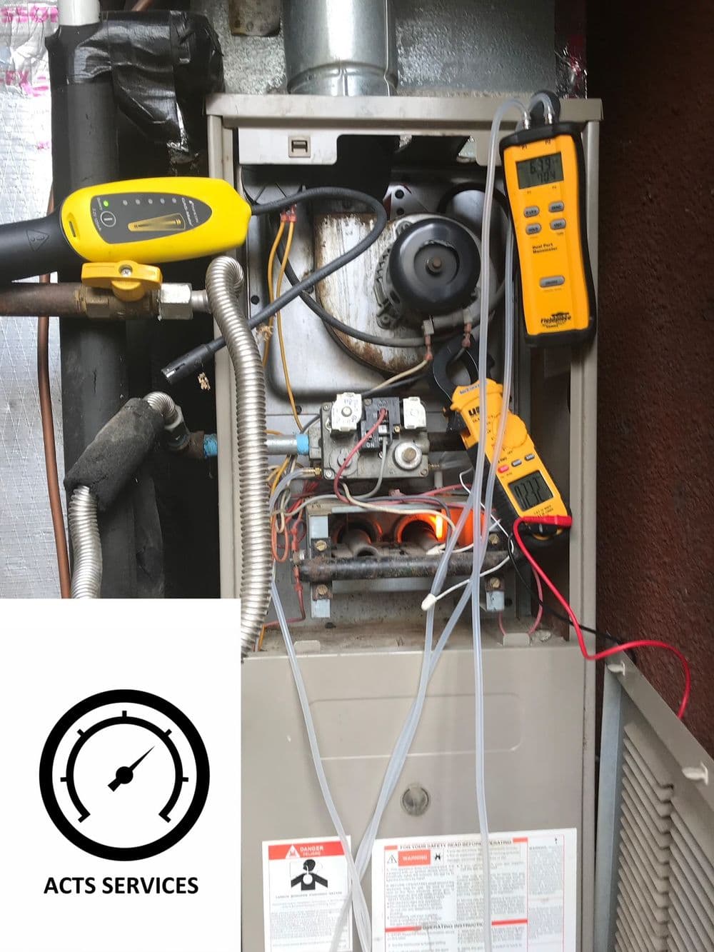 Furnace inspection with gauges and tools showing diagnostics for HVAC service.